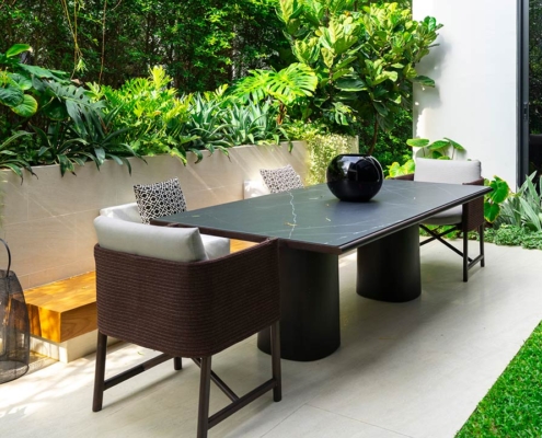 Backyard outdoor patio with modern dining table