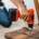 Man using hand drill to assemble a wooden table